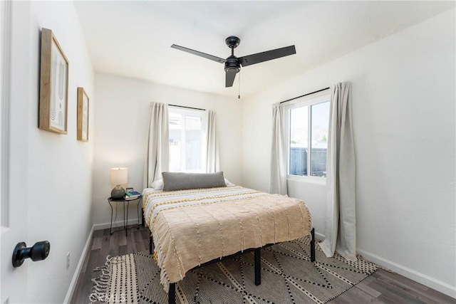 bedroom featuring dark wood-type flooring and ceiling fan