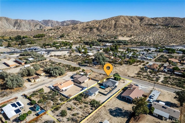 birds eye view of property featuring a mountain view