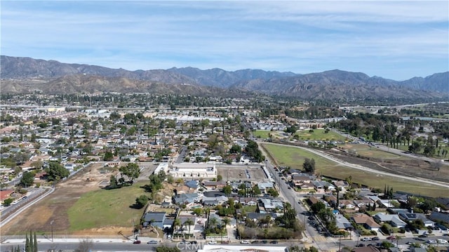 birds eye view of property with a residential view and a mountain view