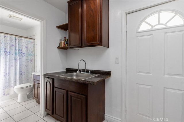 interior space featuring a sink and light tile patterned floors