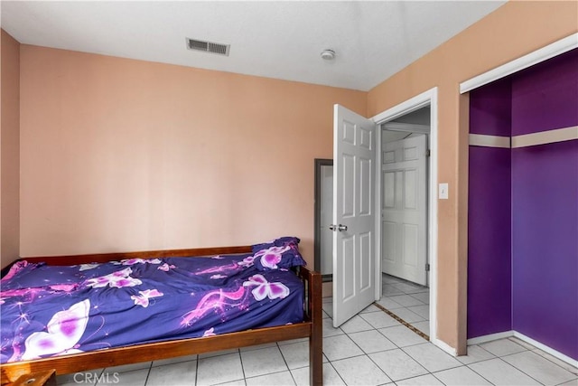 tiled bedroom with visible vents