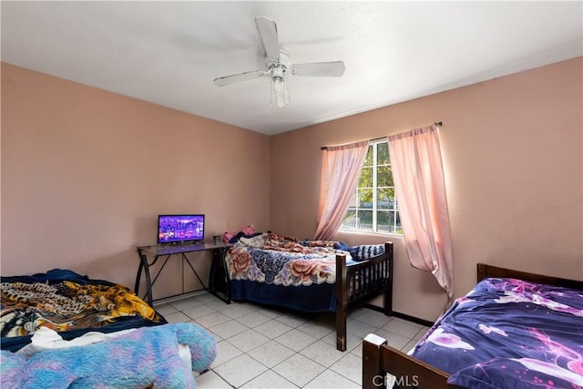 bedroom featuring ceiling fan and light tile patterned floors