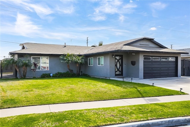 ranch-style house featuring a garage and a front lawn