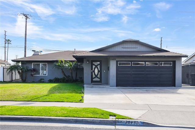 ranch-style home with a garage and a front lawn