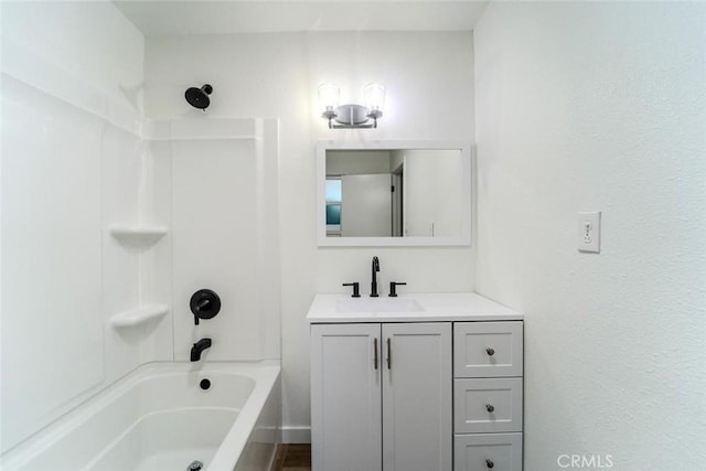 bathroom featuring vanity and  shower combination