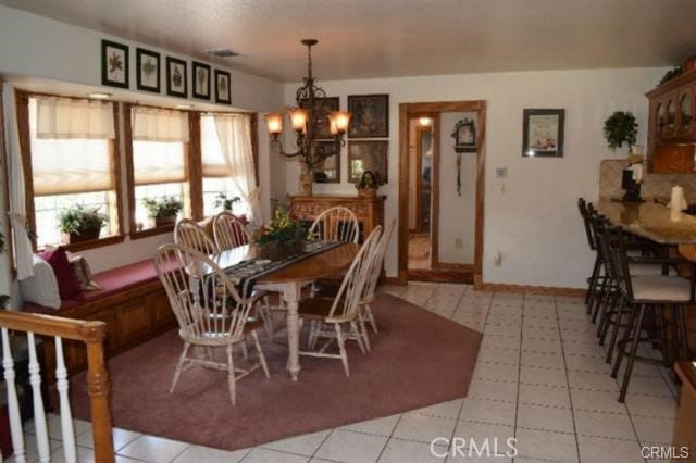 dining area with a notable chandelier