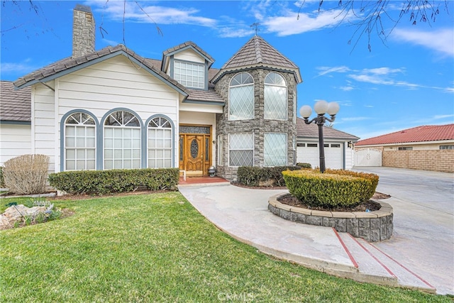 view of front facade with a garage and a front yard