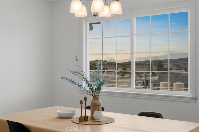 dining area featuring a notable chandelier