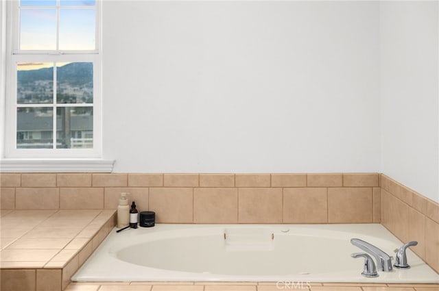 bathroom featuring tiled tub