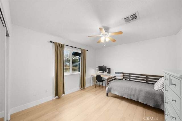 bedroom with ceiling fan and light hardwood / wood-style flooring