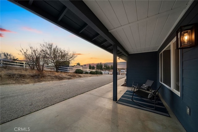 view of patio terrace at dusk