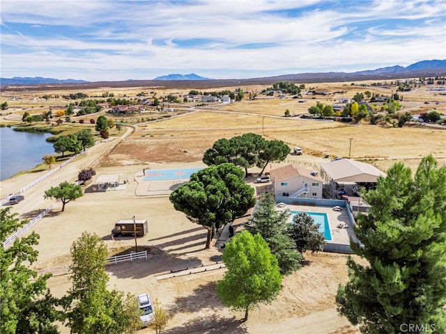 bird's eye view with a water and mountain view