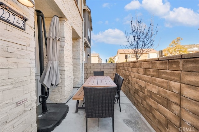 view of patio / terrace featuring fence