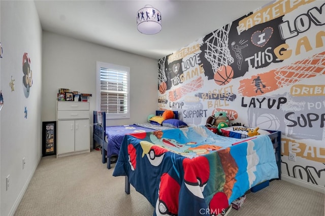 bedroom with light carpet and baseboards