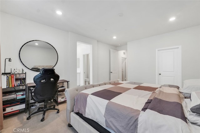 carpeted bedroom featuring ensuite bathroom