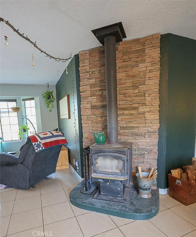 details featuring a textured ceiling and a wood stove