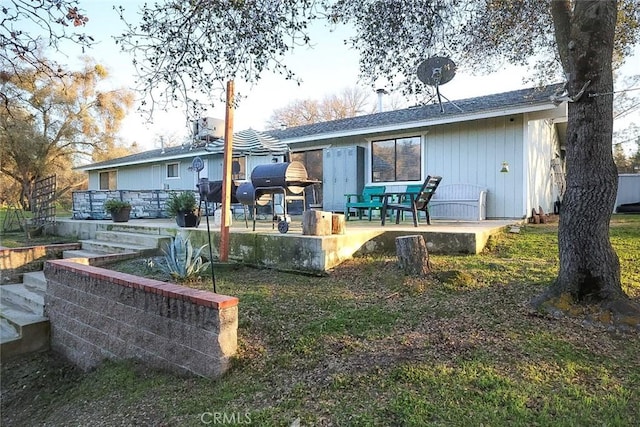 rear view of property featuring a patio area