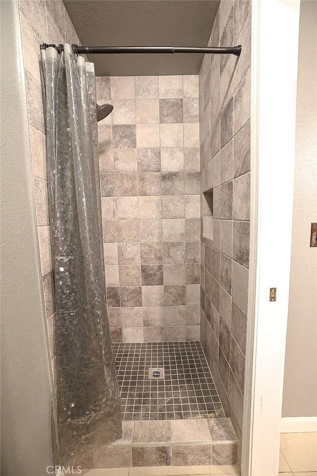 bathroom featuring a shower with curtain