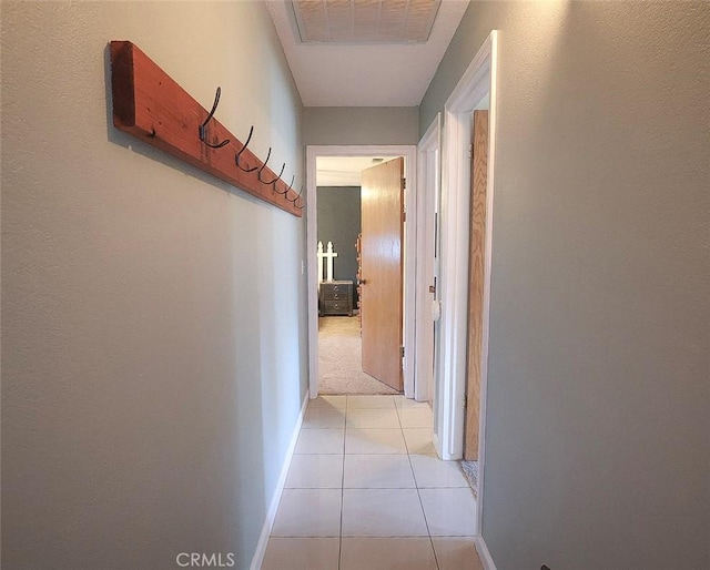 corridor with light tile patterned floors