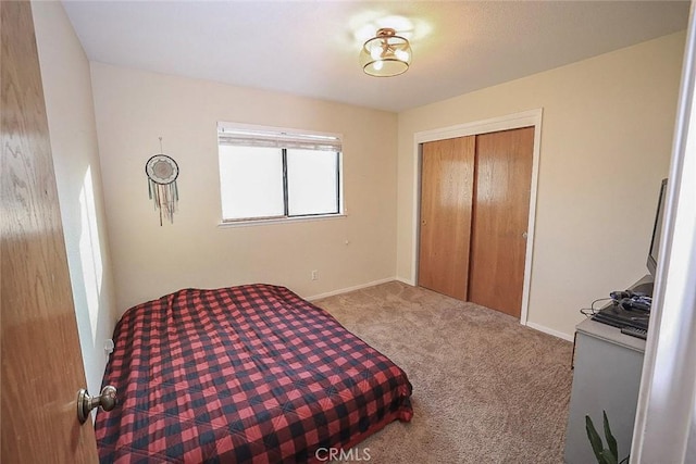 carpeted bedroom featuring a closet