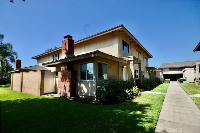 view of side of property featuring a yard