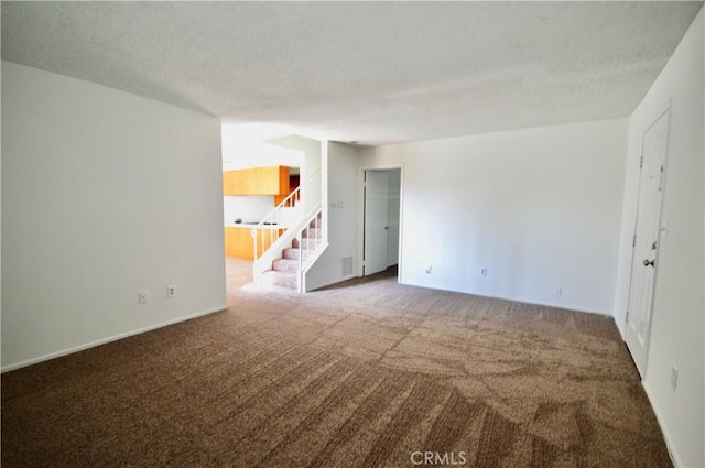 spare room featuring carpet floors