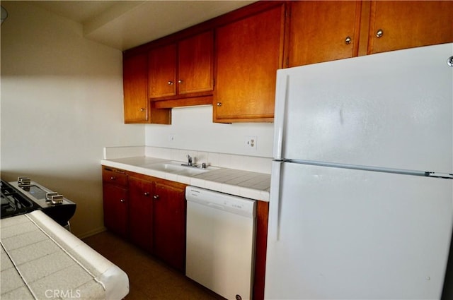 kitchen with sink and white appliances