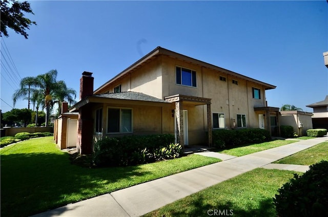 view of front of home with a front lawn