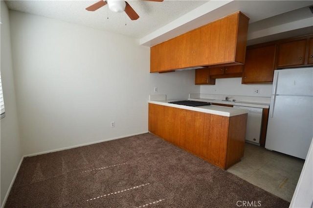 kitchen featuring dark colored carpet, white appliances, a textured ceiling, kitchen peninsula, and ceiling fan