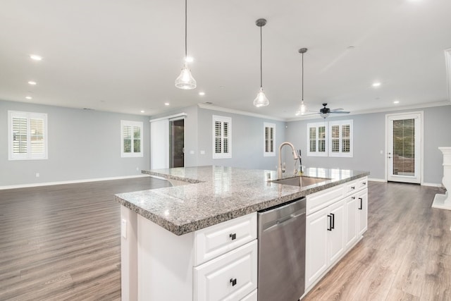 kitchen featuring sink, a center island with sink, dishwasher, light stone countertops, and white cabinets