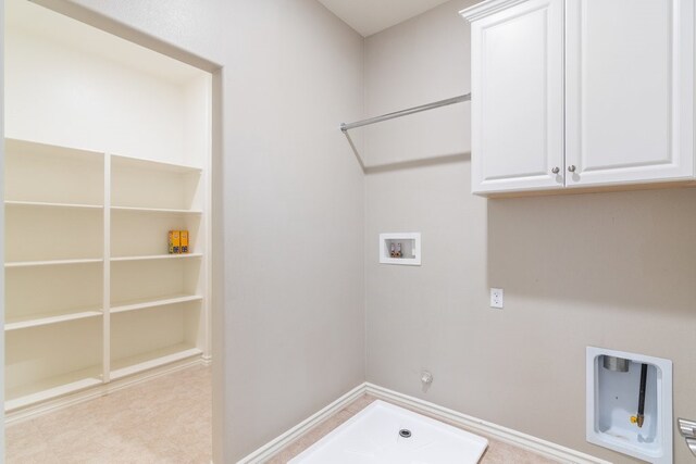 laundry room with washer hookup, cabinets, and hookup for a gas dryer