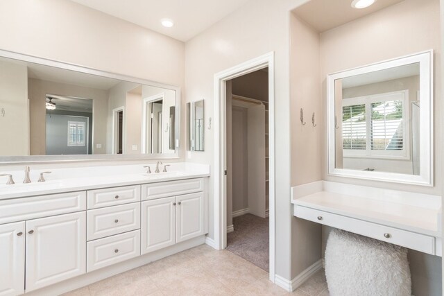 bathroom with ceiling fan and vanity