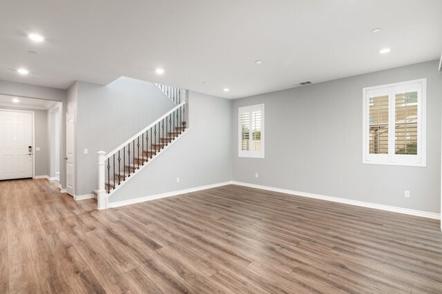 unfurnished room with light hardwood / wood-style flooring