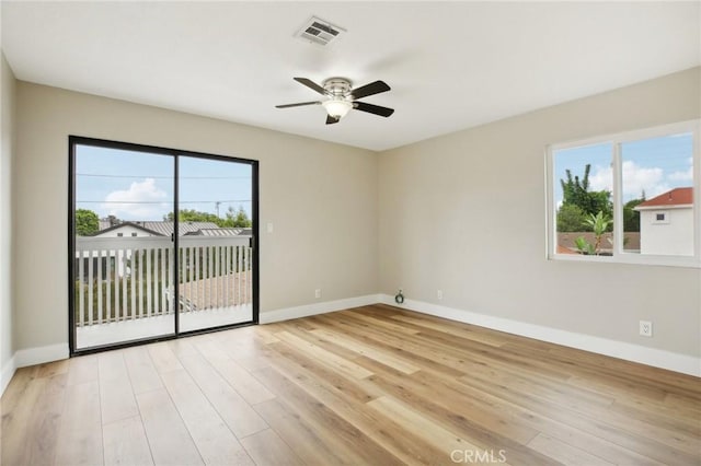 spare room featuring ceiling fan and light hardwood / wood-style floors