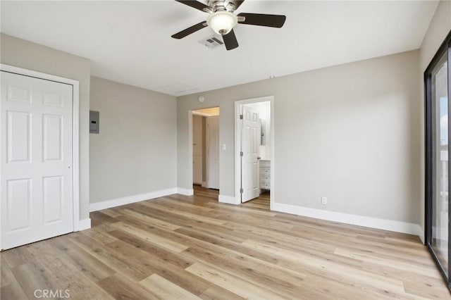 unfurnished bedroom with ceiling fan, connected bathroom, and light wood-type flooring