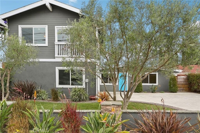 view of front of house with a balcony