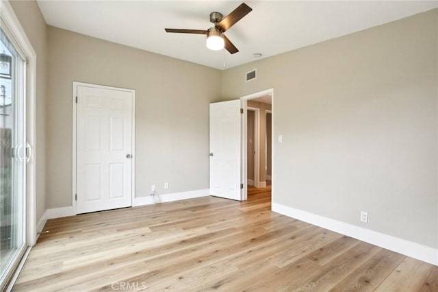 unfurnished bedroom featuring ceiling fan and light wood-type flooring