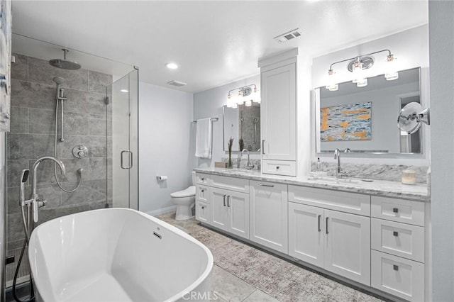 full bathroom featuring toilet, tile patterned floors, vanity, and shower with separate bathtub