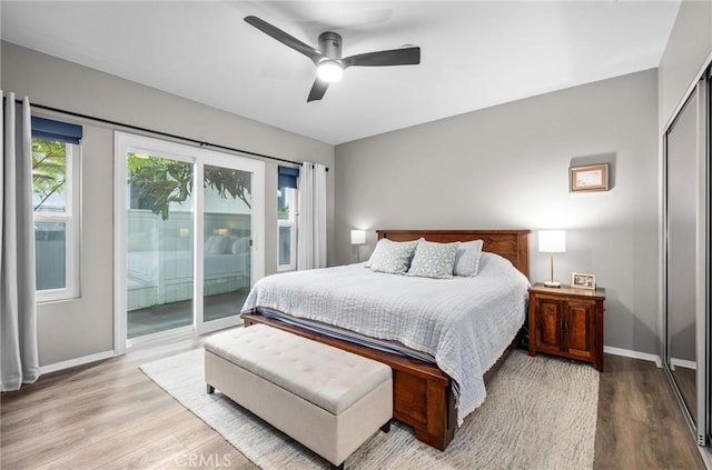 bedroom featuring access to exterior, a closet, ceiling fan, and light wood-type flooring