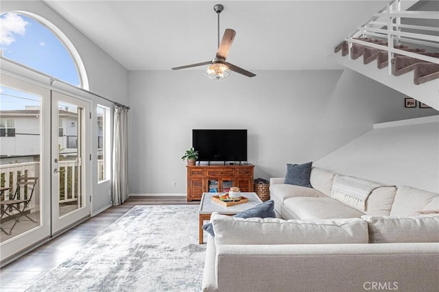 living room featuring hardwood / wood-style flooring and ceiling fan