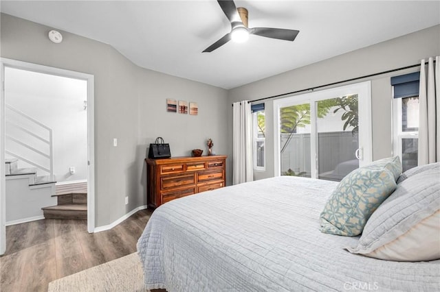 bedroom with dark hardwood / wood-style floors, access to outside, and ceiling fan