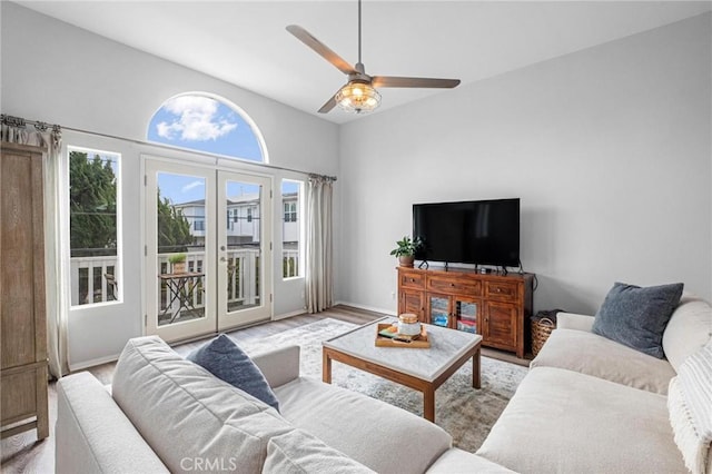 living room with ceiling fan and light hardwood / wood-style floors