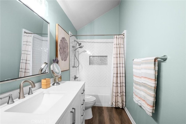 full bathroom with lofted ceiling, vanity, wood-type flooring, toilet, and shower / bath combo with shower curtain