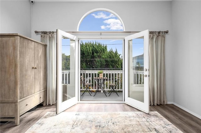 doorway to outside with hardwood / wood-style flooring, a healthy amount of sunlight, and french doors