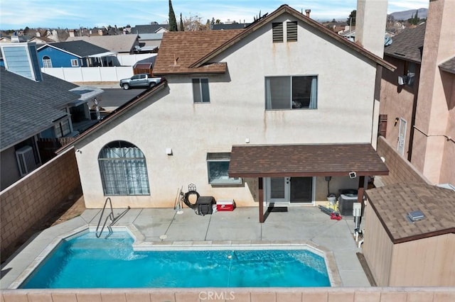 back of house featuring a patio area