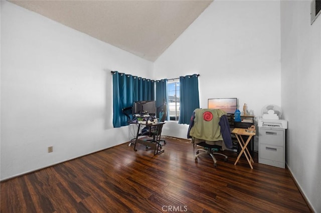 office space with dark hardwood / wood-style flooring and high vaulted ceiling