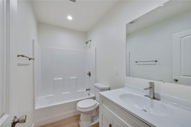 full bathroom with shower / tub combination, wood-type flooring, vanity, and toilet