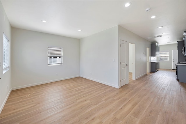 unfurnished living room with light hardwood / wood-style flooring