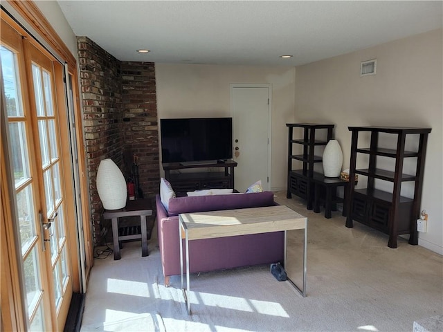 carpeted bedroom with french doors