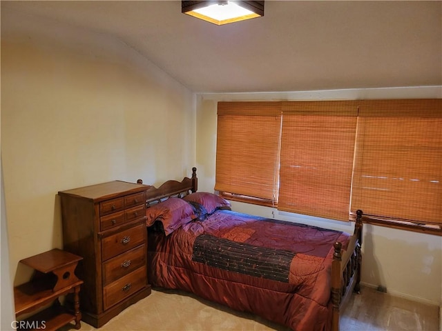 bedroom featuring vaulted ceiling